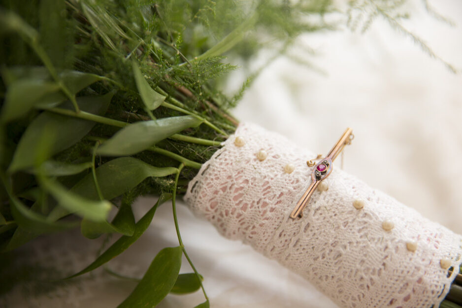 close-up on grandmother's brooch on wedding bouquet at Smarden village home in Kent