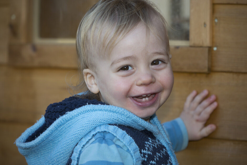 toddler boy smiling in his treehouse in Tonbridge, Kent