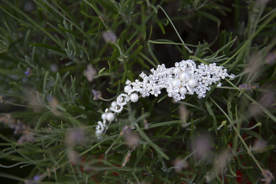 bride's hair piece captured with rosemary plant background