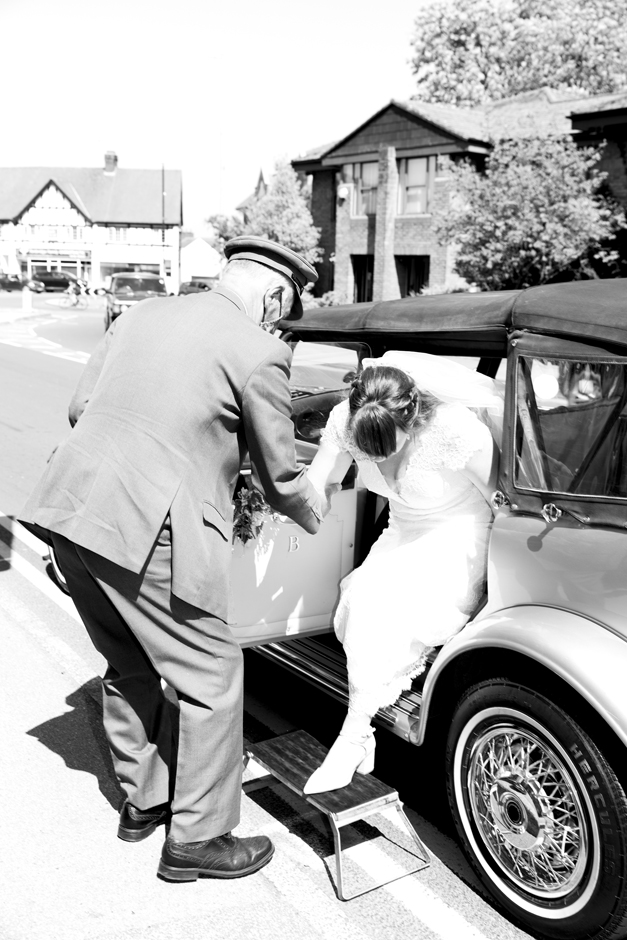 Bride arriving at Lynch Gate entrance at St Stephen's Church in Tonbridge, Kent