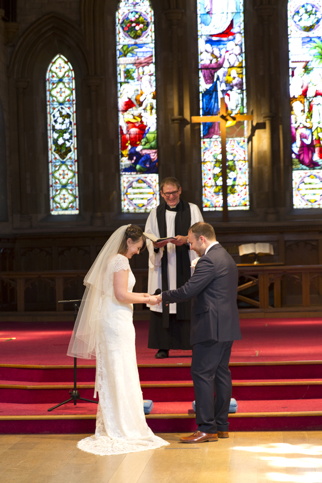 Bride and Groom exchanging rings at St Stephen's church wedding in Tonbridge, Kent