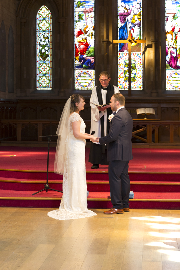 Bride and Groom exchanging vows at St Stephen's Church wedding in Tonbridge, Kent