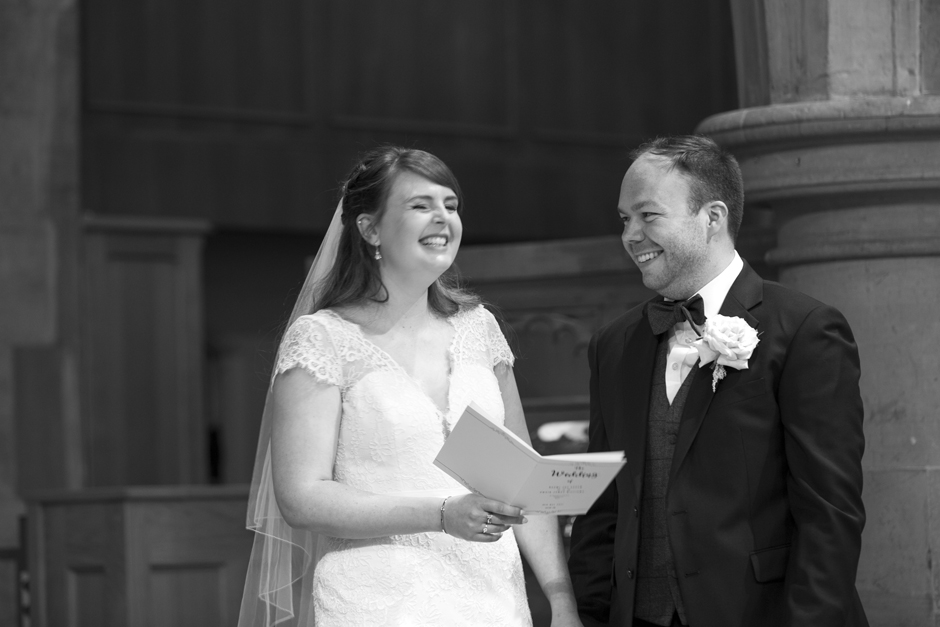 Bride and Groom laughing during St Stephen's Church wedding ceremony in Tonbridge, Kent