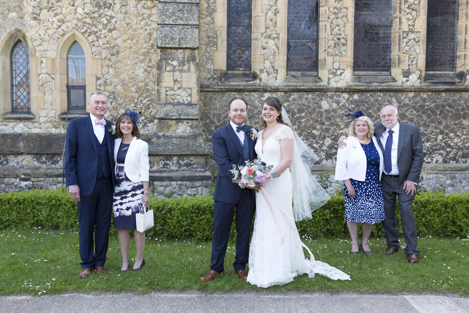 Bride and groom socially distant group shot with parents at St Stephen's Church in Tonbridge, Kent