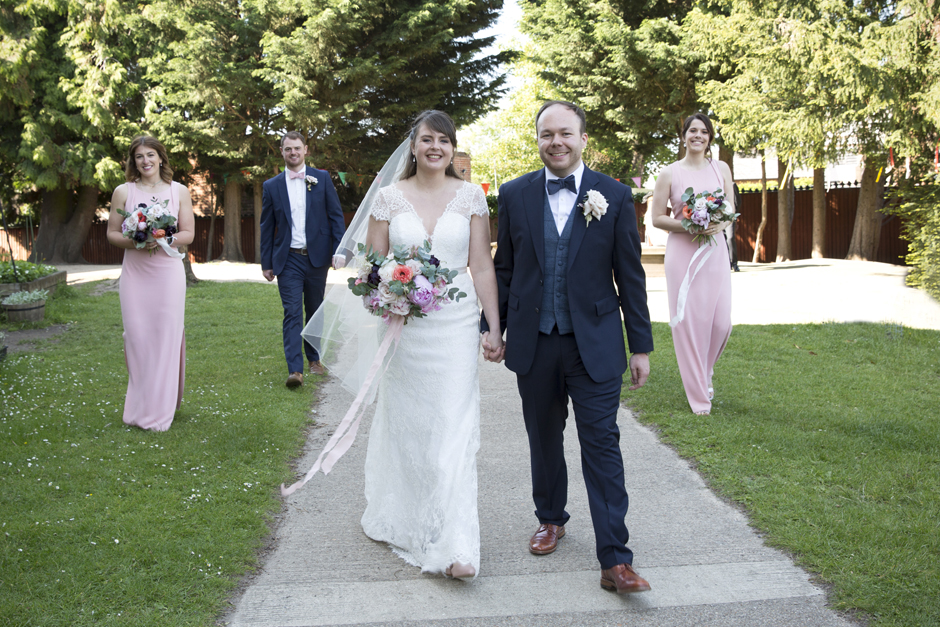 Bride and Groom walking with best man and bridesmaids at socially distant wedding in Tonbridge, Kent