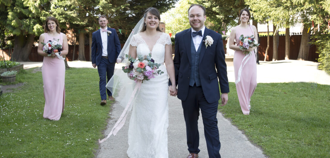 Bride and Groom walking with best man and bridesmaids at socially distant wedding in Tonbridge, Kent