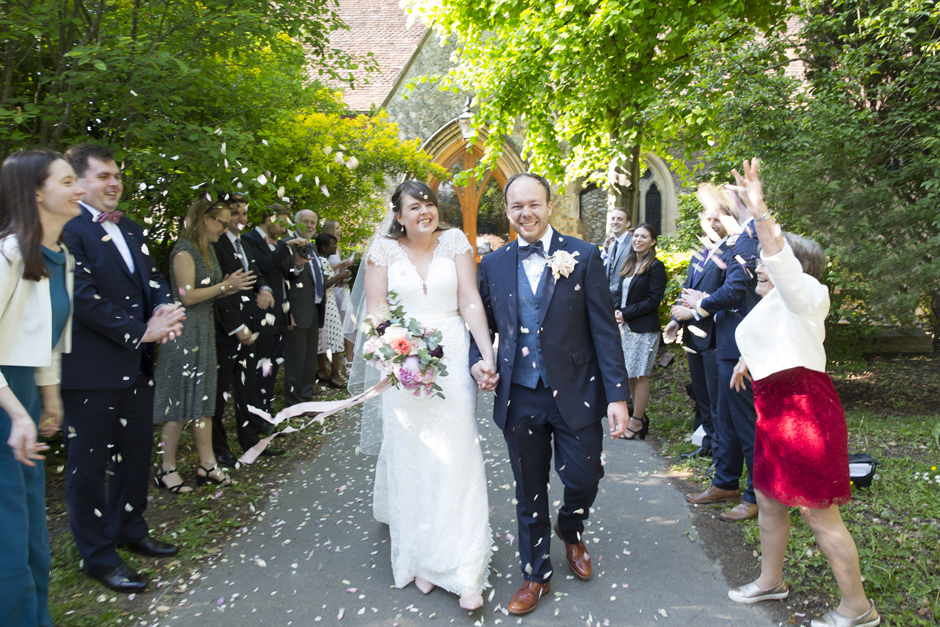 Bride and Groom confetti tunnel outside St Stephen's Church in Tonbridge, Kent