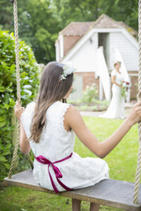 bridesmaid on swing captured by kent wedding photographer Victoria Green
