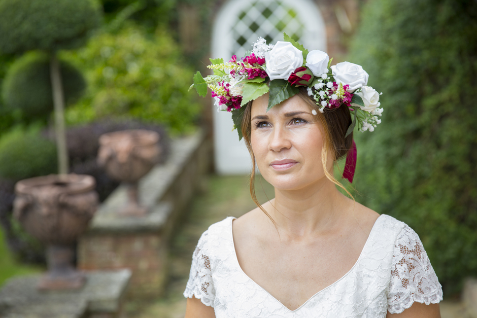 Bride with silk flowers wreath captured by Kent wedding photographer Victoria Green