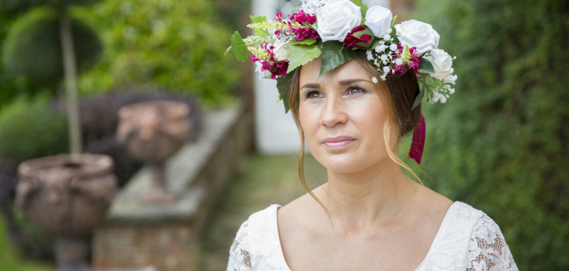 Bride with artificial flower headers in Benenden Kent, captured by Kent wedding photographer Victoria Green,