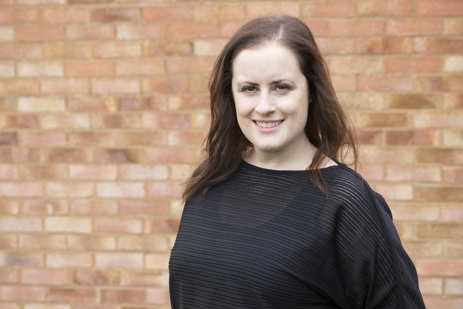 Business woman portrait head shot with blurred brick backdrop captured by Kent photographer Victoria Green