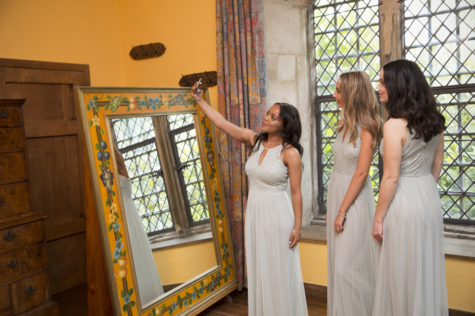 Bridesmaids taking a selfie in the bridal suite at Nettlestead Place, Maidstone in Kent.