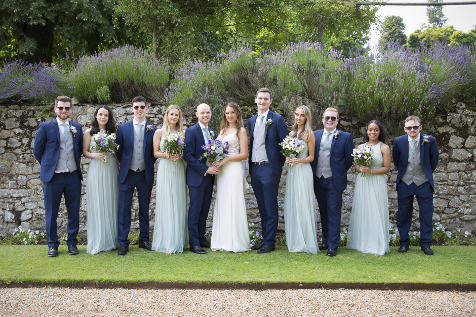 Bride and groom with groomsmen and bridesmaids at Nettlestead Place wedding in Kent.