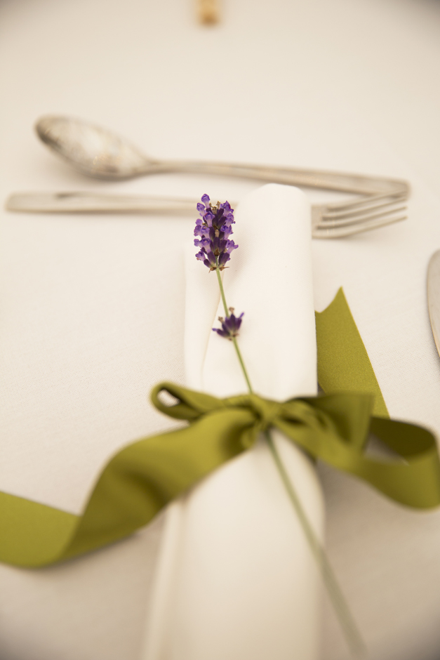 Sprig of lavender on table at Nettlestead Place wedding in Kent.