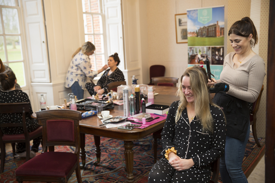 Bridesmaids getting wedding hair and make-up done at Bradbourne House in East Malling, Kent.