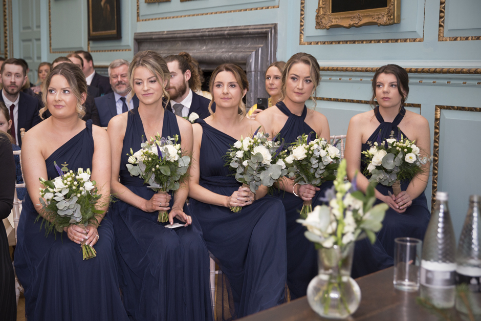 Close-up of bridesmaids with tears in their eyes at Bradbourne House wedding ceremony in East Malling, Kent.