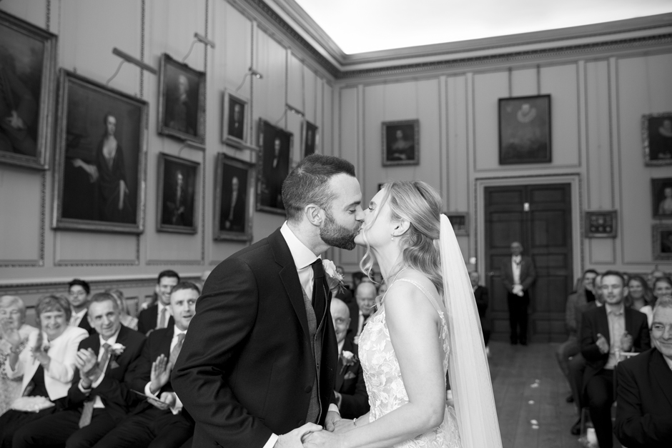 Bride and Groom first kiss during wedding ceremony at Bradbourne House in East Malling, Kent.