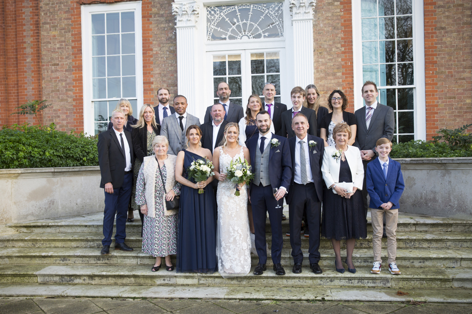 Wedding family group shot captured on front steps at Bradbourne House in East Malling, Kent.