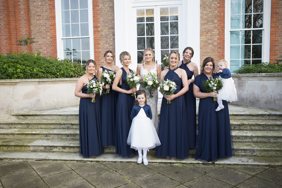 Bride and Bridesmaids with flower girls captured on the front steps at Bradbourne House in East Malling, Kent.
