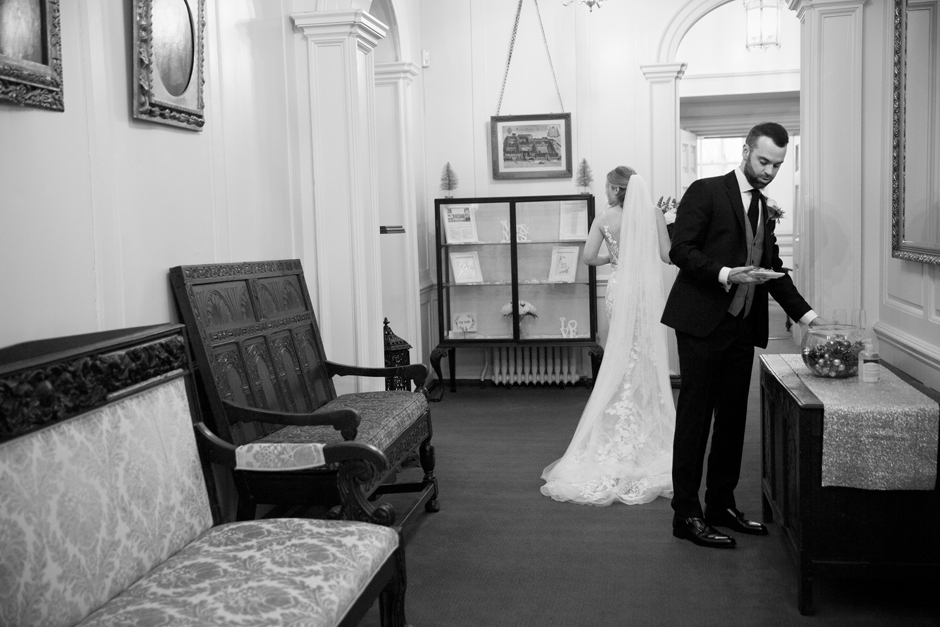Natural Unposed Shot of Bride and Groom in the hallway at Bradbourne House in East malling, Kent.