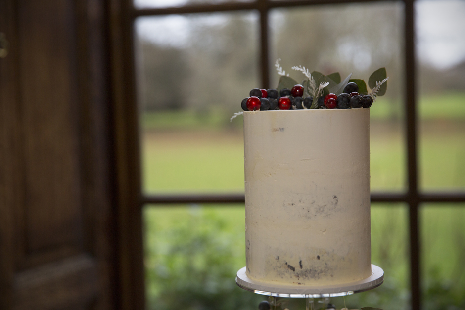 Top tier of cake with berries on top at Bradbourne House in East Malling, Kent.