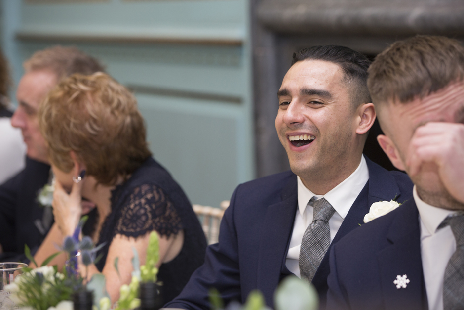 Best Man laughing during wedding breakfast at Bradbourne House in East Malling, Kent.