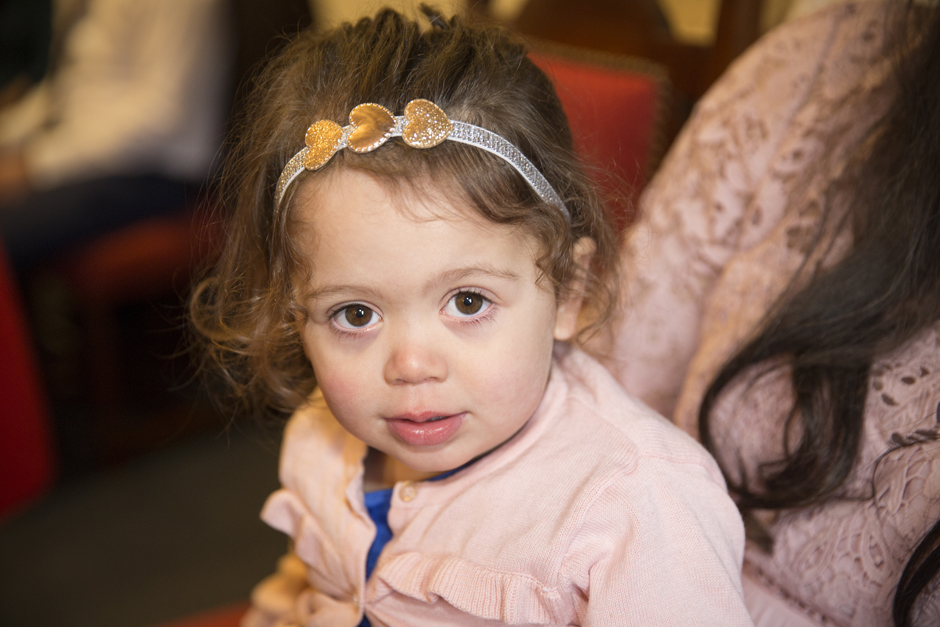 Little Girl dressed sitting at ceremony at Archbishop's Palace in Maidstone, Kent