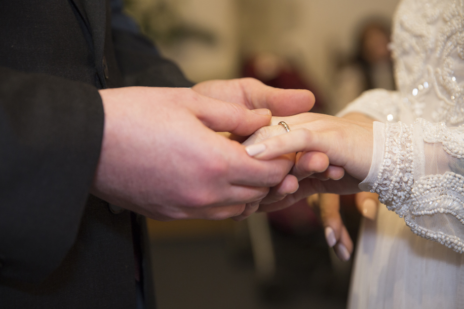Close up of ring exchange at wedding ceremony in The Undercroft at Archbishop's Palace in Maidstone, Kent captured by Kent based wedding photographer Victoria Green